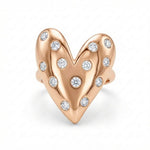 Load image into Gallery viewer, Rose gold heart-shaped earring with embedded diamonds on a white background