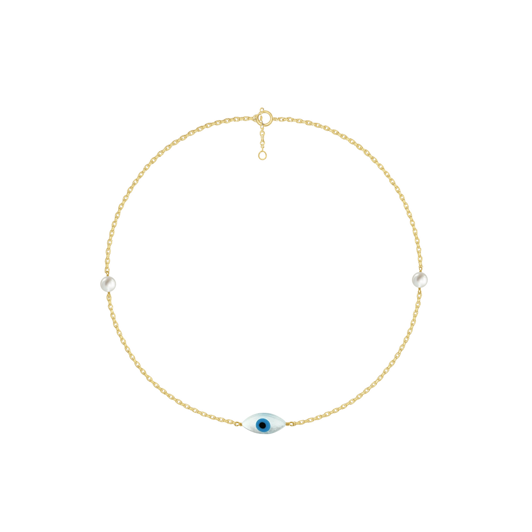 Gold necklace with a blue evil eye pendant on a white background