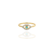 Gold ring with a turquoise gemstone and diamond accents on a white background