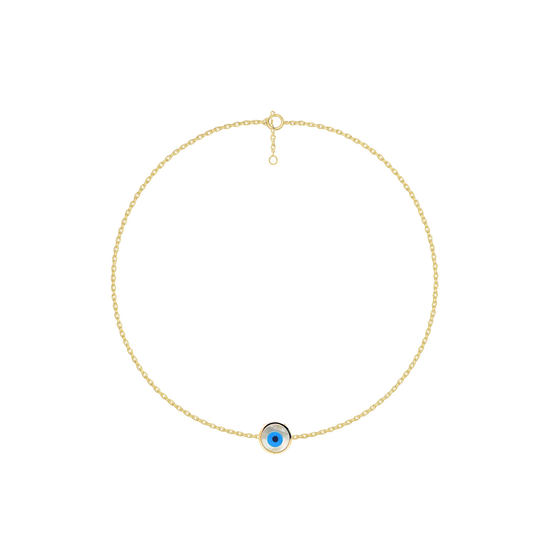 Gold necklace with a blue eye pendant on a white background