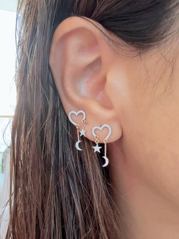 Dazzling diamond heart with dangling star and moon earrings.