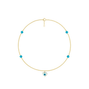 Gold necklace with blue beads on a white background