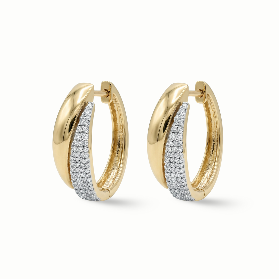 Pavé diamond huggie earrings 18K gold women Dubai UAE
